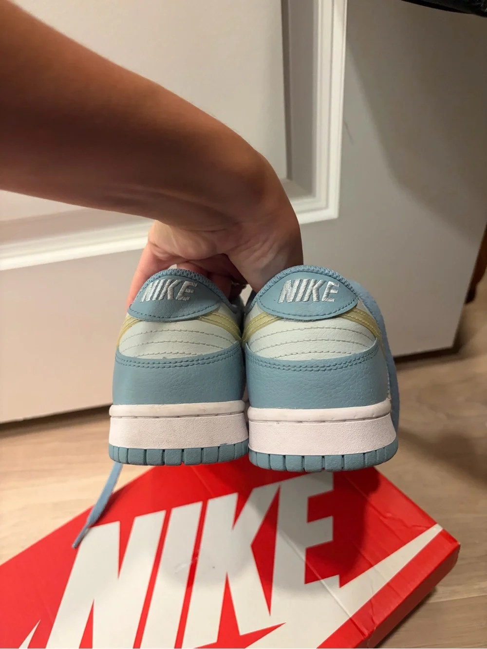 Nike Kids Low-Top Sneakers in Light Blue and Creamy Yellow Swoosh